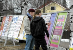 Young men looked at campaign posters in Siltamäki, Helsinki, before the 2011 parliamentary elections. 