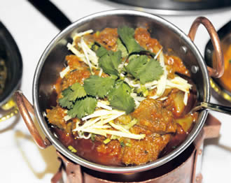 Lamb Masala cooked in a hot, spicy tomato sauce with chilli and ginger.