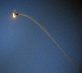A picture taken in Gaza City on 9 July shows the trail of a missile from the Israeli Irone Dome defence system, as it intercepts and destroys a rocket launched from the Gaza strip into Israel. 